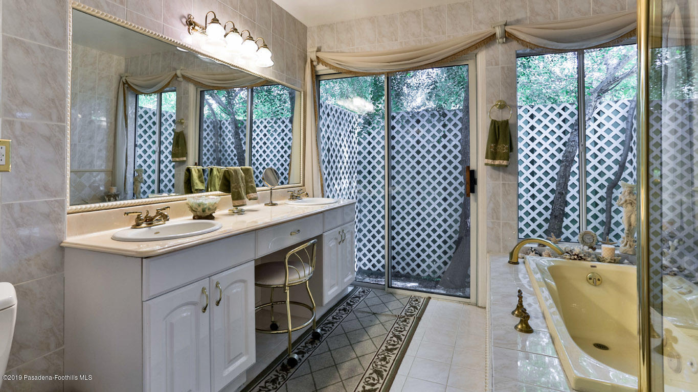 3810 Fairmeade Road Pasadena, CA 91107 - Photo 33 of 47 a bathroom with a sink and a mirror