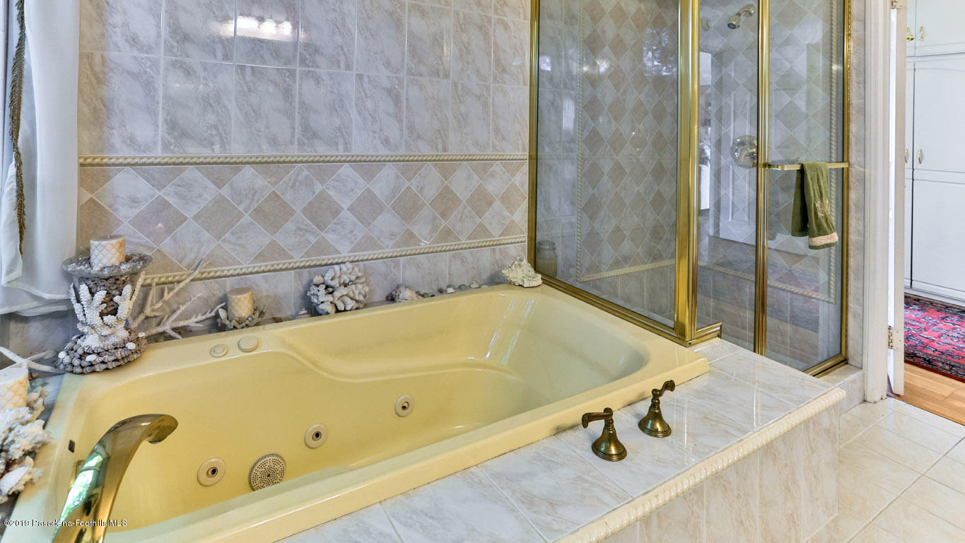 3810 Fairmeade Road Pasadena, CA 91107 - Photo 34 of 47 a bathroom with a tub and a shower