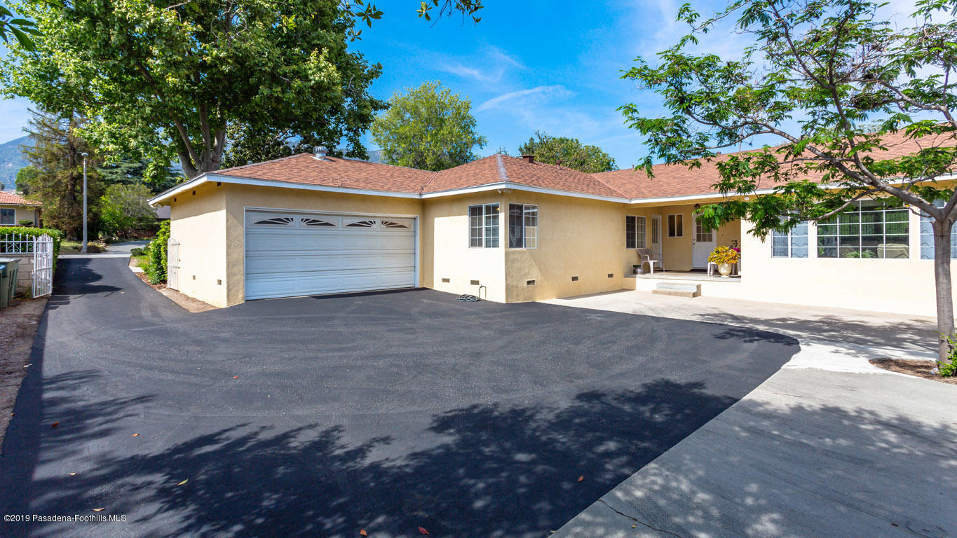 3810 Fairmeade Road Pasadena, CA 91107 - Photo 39 of 47 a front view of a house with a yard and garage