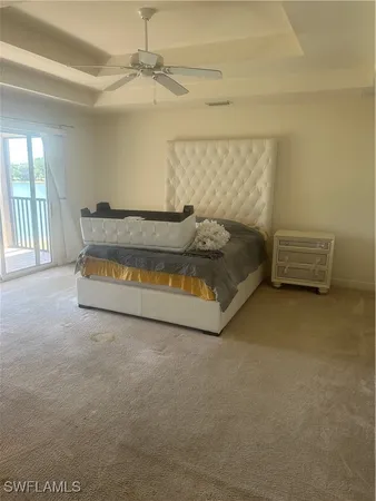 a bed sitting in a room next to a window