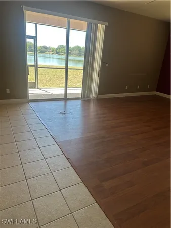 a view of an empty room and a window