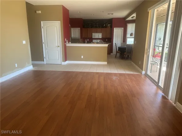 a view of kitchen and wooden floor
