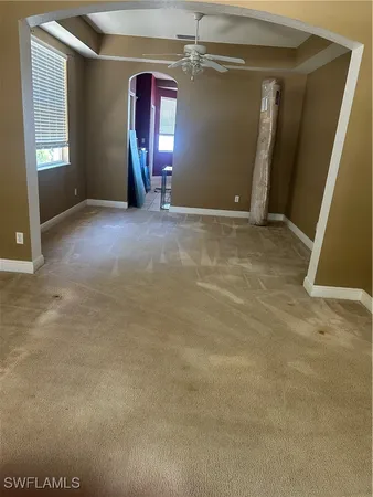 en empty room with windows