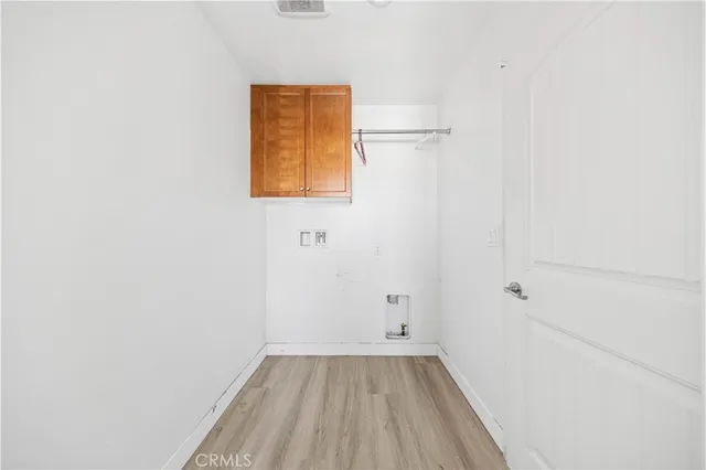 a view of a room with wooden floor and small space