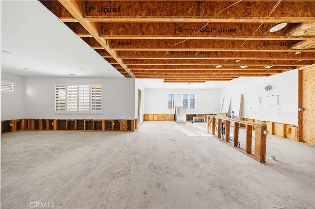 a view of an empty room with windows