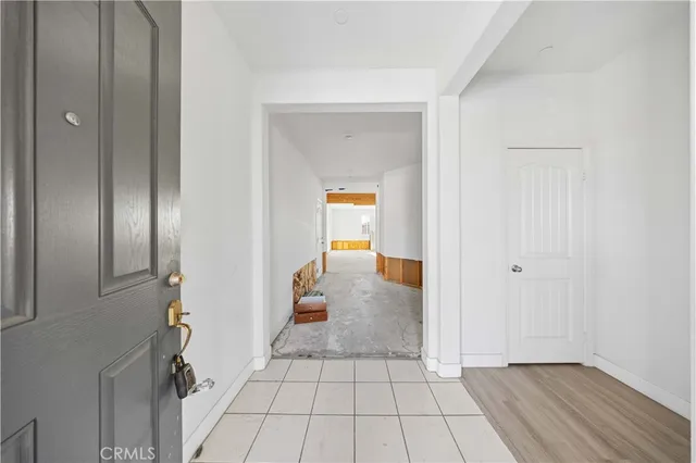 a view of a hallway view with wooden floor and staircase