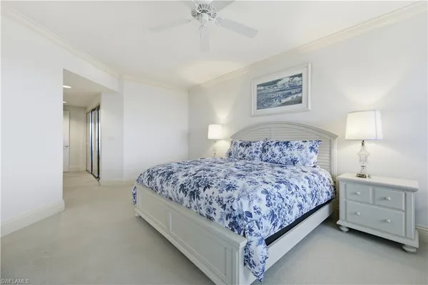 a bedroom with a bed and cabinets