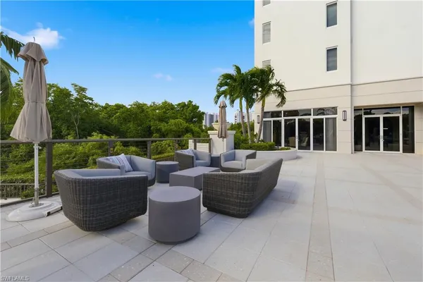 a view of a swimming pool with chairs
