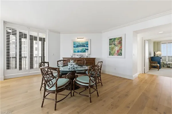 a view of a dining room with furniture and wooden floor