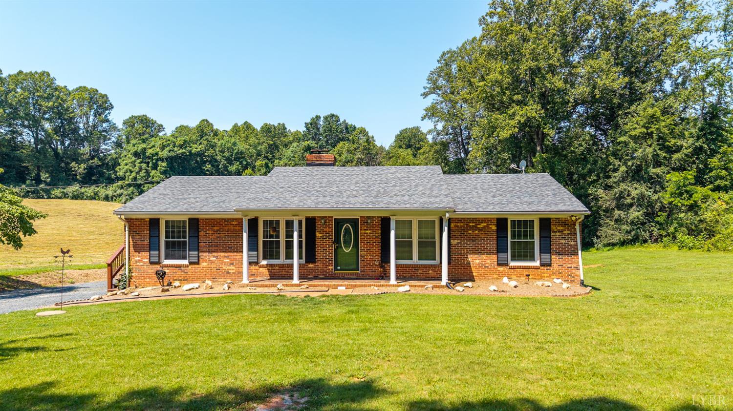 a front view of a house with a yard table and chairs