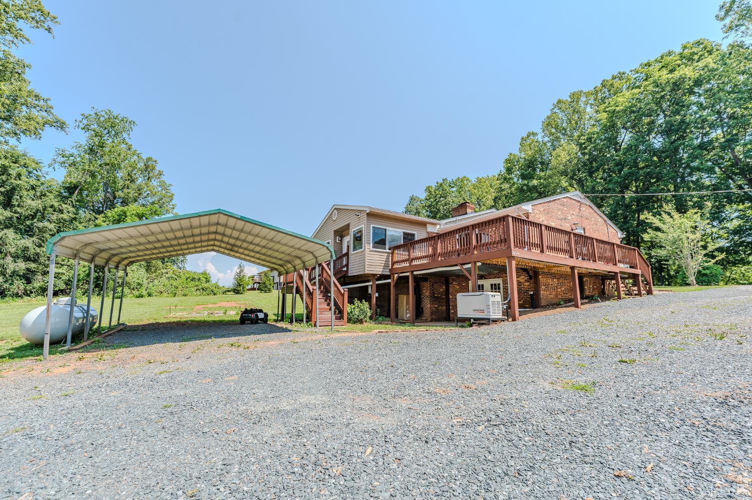 1553 Old Stage Road Amherst, VA 24521 - Photo 15 of 61 a view of a large house with a big yard and large trees