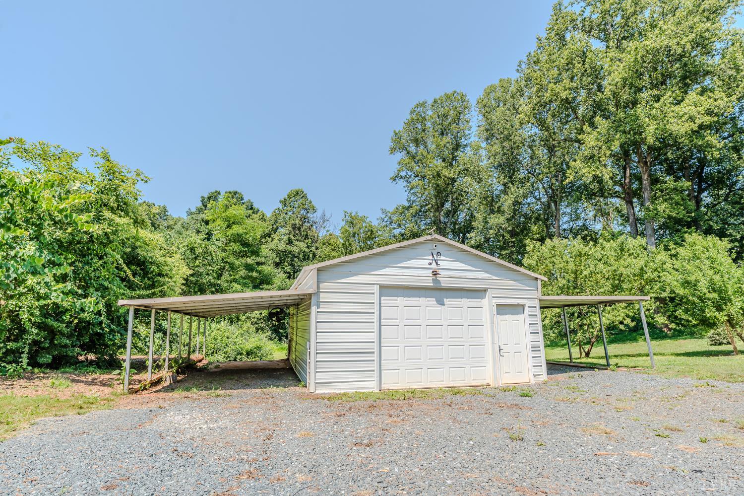 1553 Old Stage Road Amherst, VA 24521 - Photo 17 of 61 a front view of a house with a yard and garage