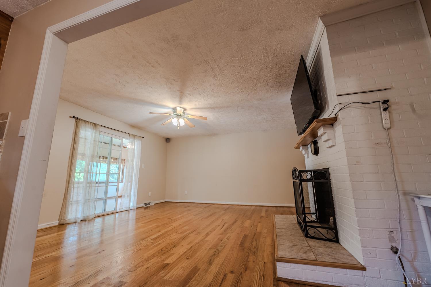 1553 Old Stage Road Amherst, VA 24521 - Photo 31 of 61 wooden floor in an empty room with a window