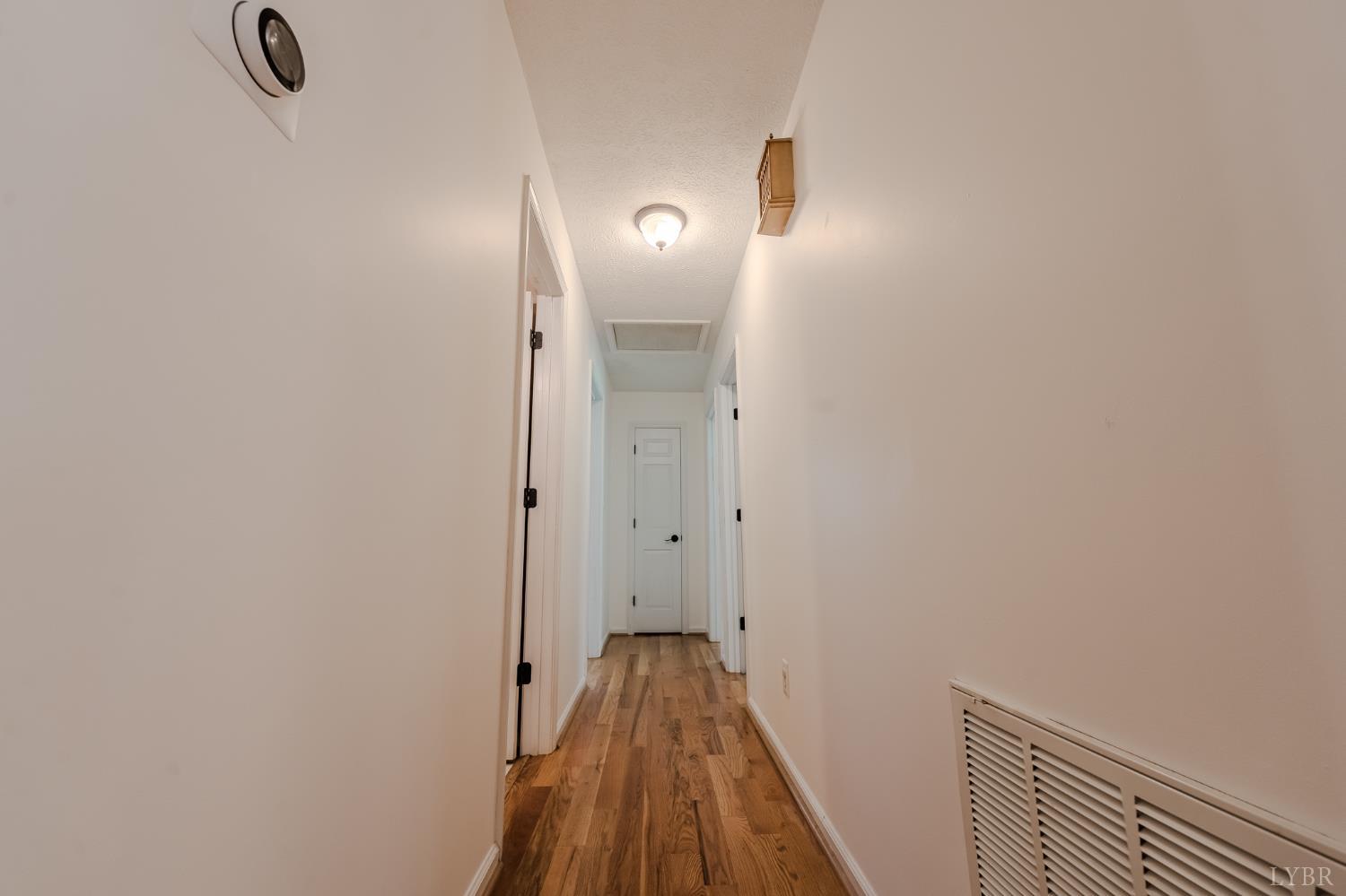 1553 Old Stage Road Amherst, VA 24521 - Photo 38 of 61 a view of a hallway with wooden floor