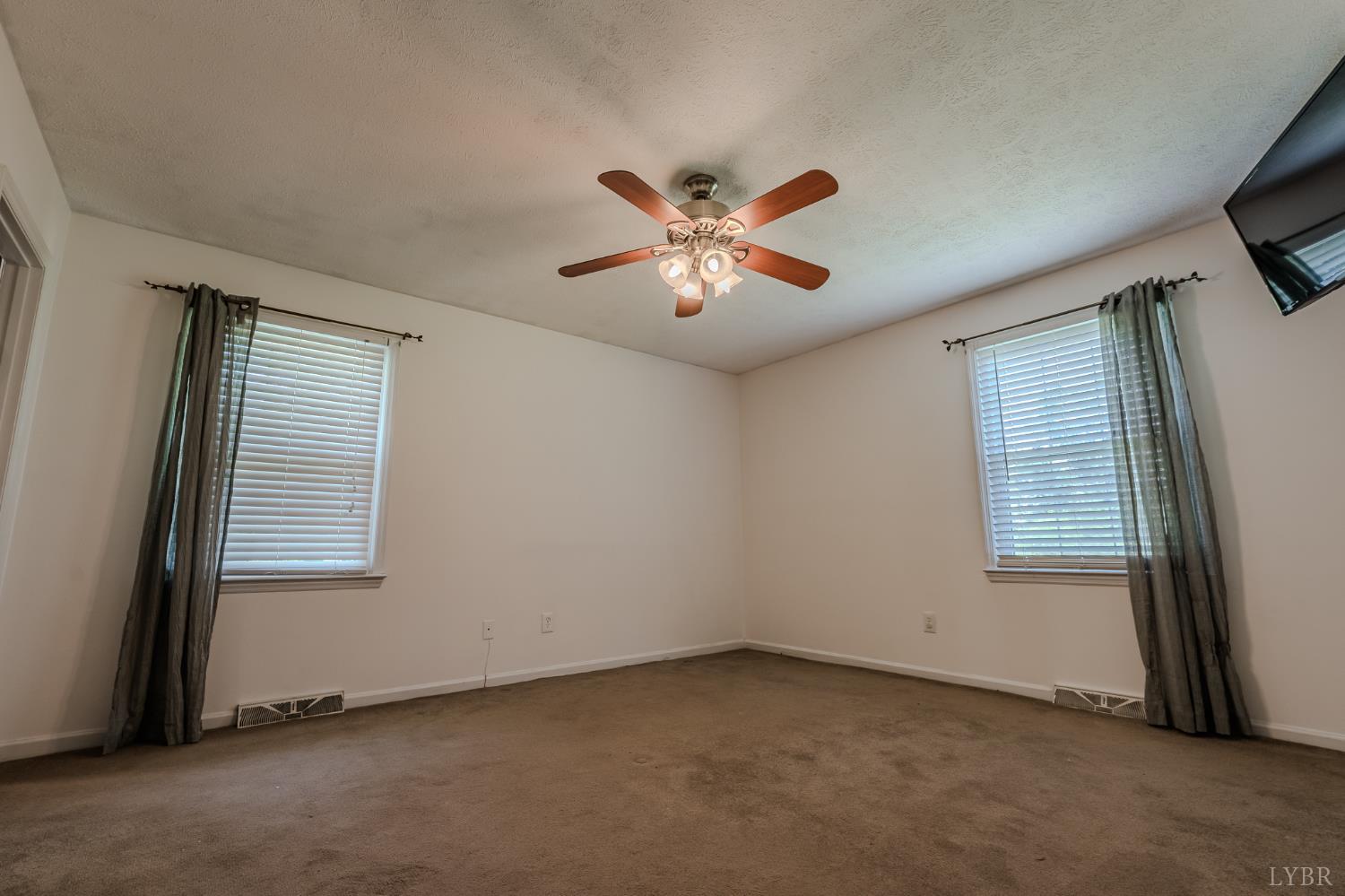 1553 Old Stage Road Amherst, VA 24521 - Photo 43 of 61 an empty room with windows and fan