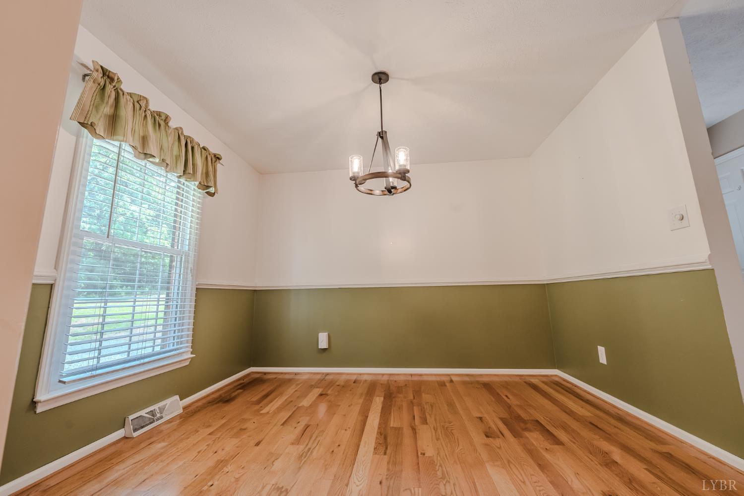 1553 Old Stage Road Amherst, VA 24521 - Photo 48 of 61 a view of empty room with wooden floor and fan