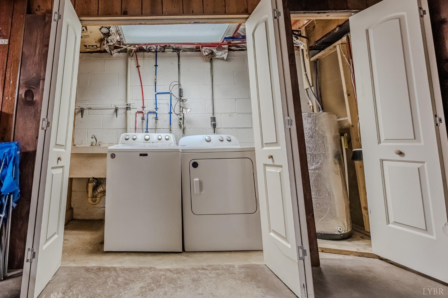 1553 Old Stage Road Amherst, VA 24521 - Photo 53 of 61 a utility room with cabinets washer and dryer