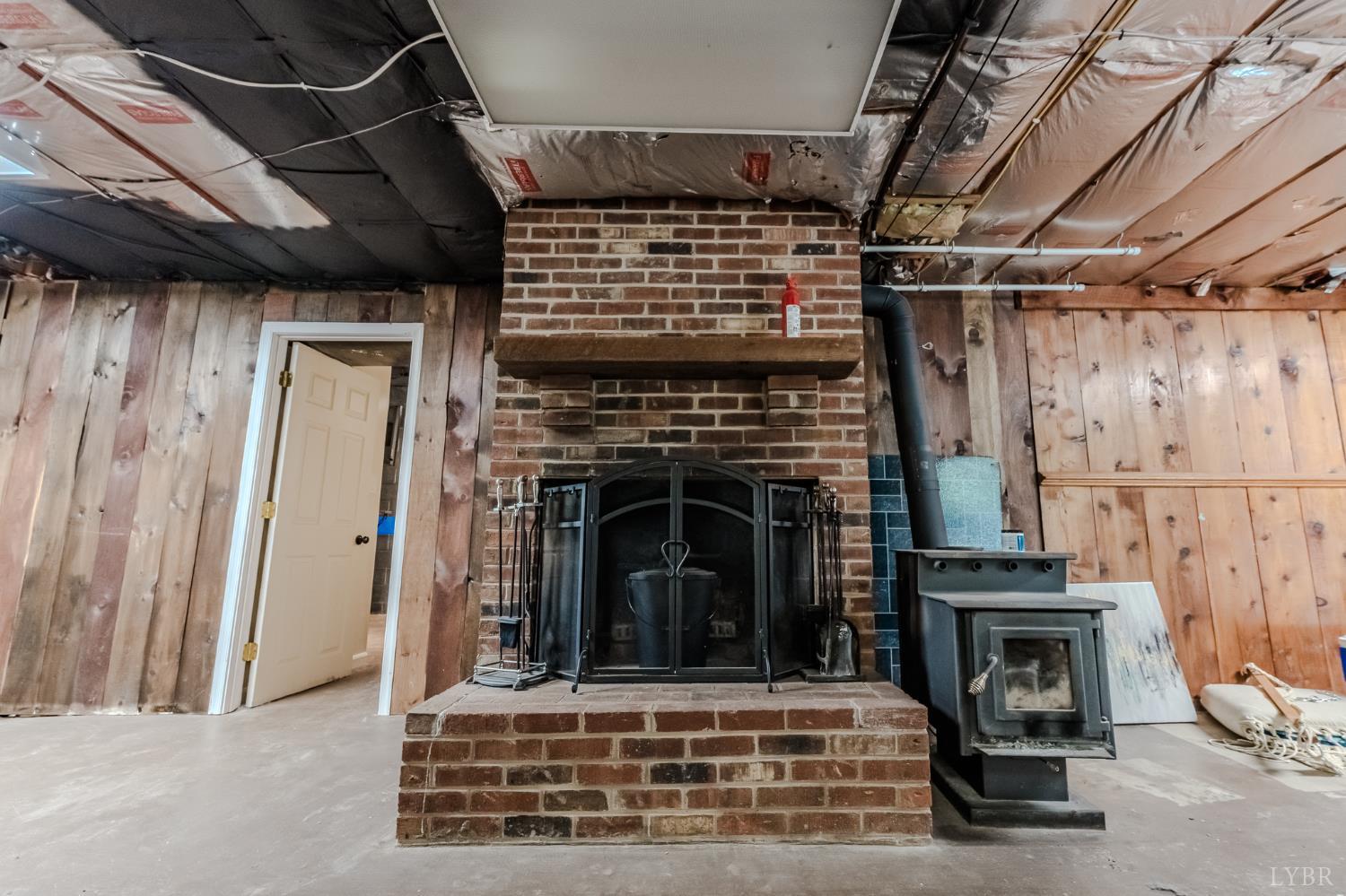 1553 Old Stage Road Amherst, VA 24521 - Photo 54 of 61 a living room with furniture and a fireplace