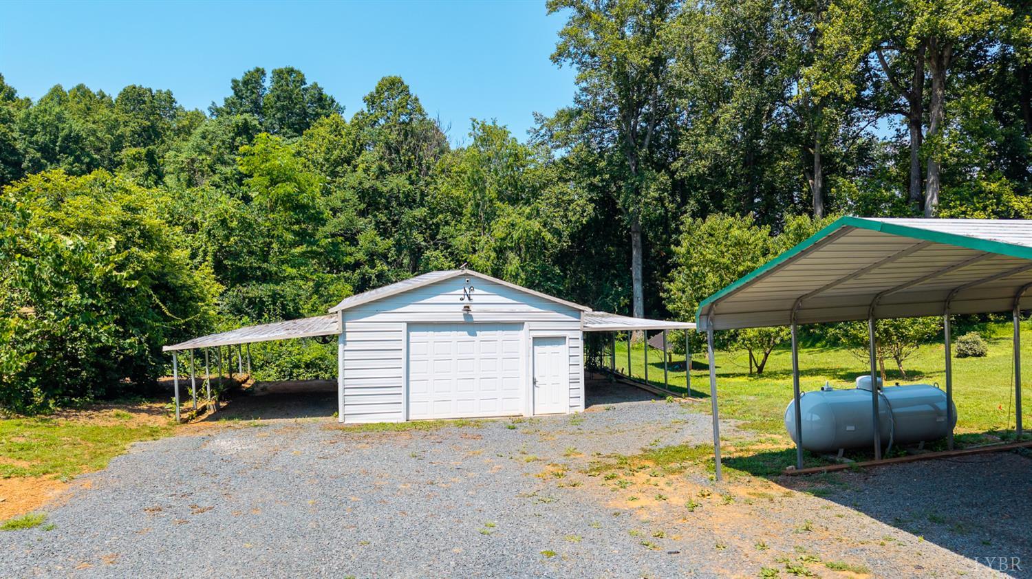 1553 Old Stage Road Amherst, VA 24521 - Photo 7 of 61 a front view of a house with a yard and garage