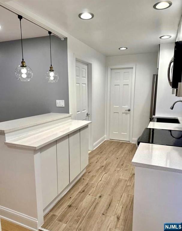 61 Hille Place, Unit 2 Ridgefield Park, NJ 07660 - Photo 2 of 19 a kitchen with a sink and a refrigerator