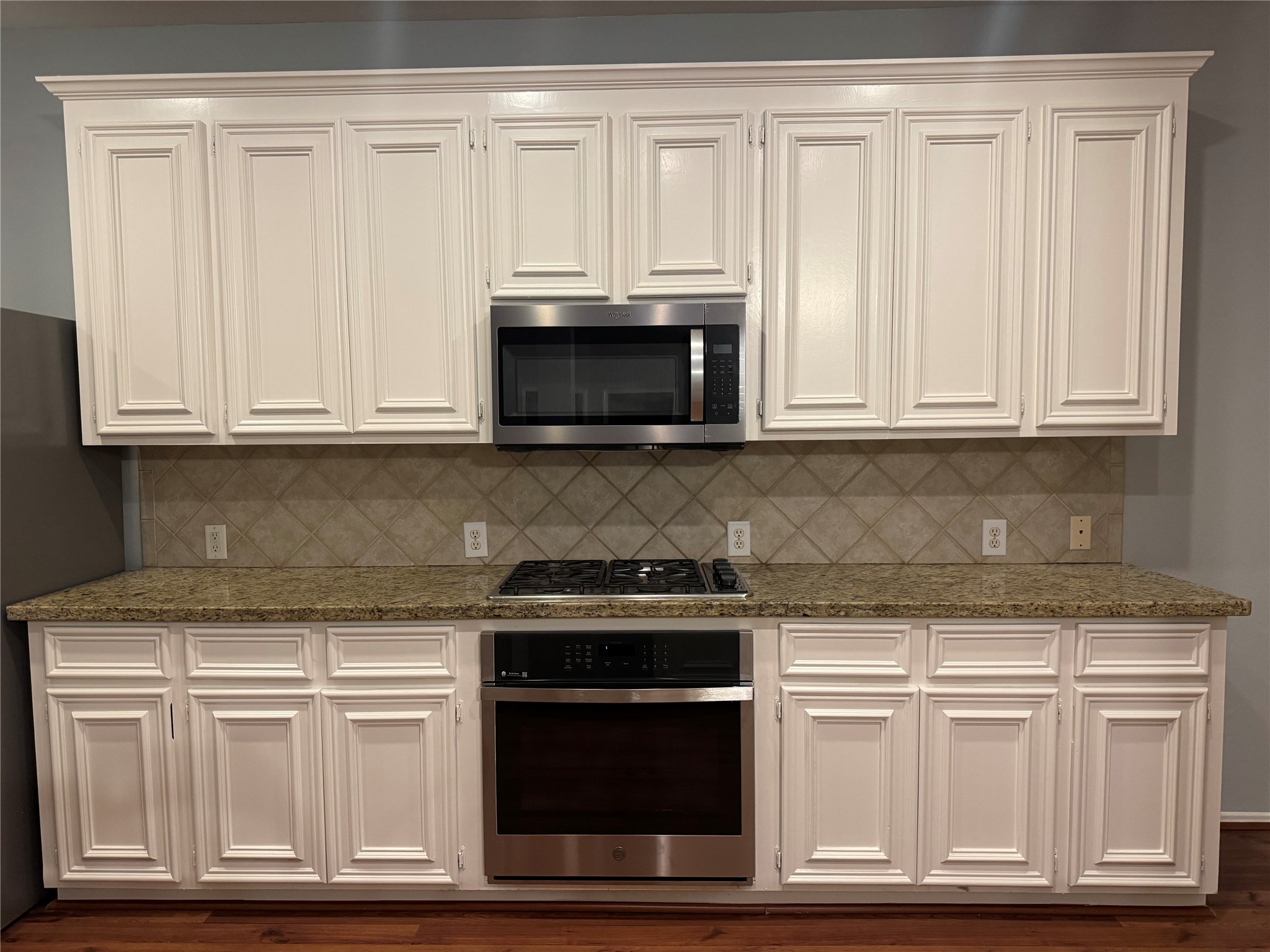 16210 Broken Timber Circle Houston, TX 77095 - Photo 3 of 28 Beautiful kitchen with granite countertops and white cabinetry!