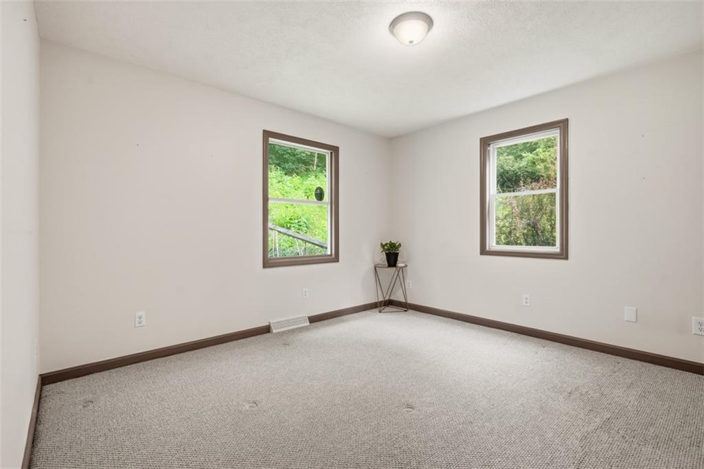 8517 Wittmer Road Pittsburgh, PA 15237 - Photo 25 of 46 an empty room with windows