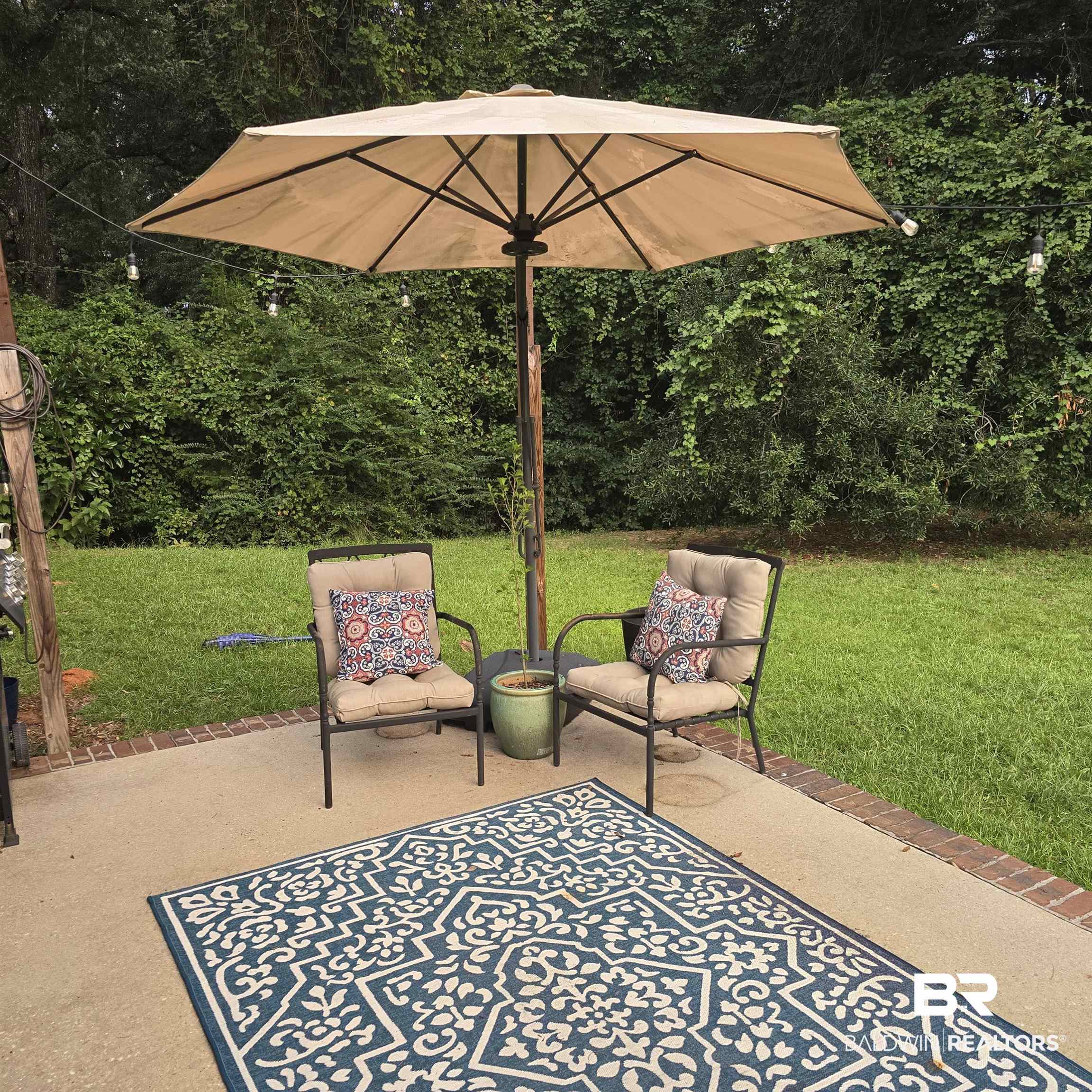 12230 Bromley Road Stapleton, AL 36578 - Photo 32 of 34 View of patio / terrace with view of wooded area