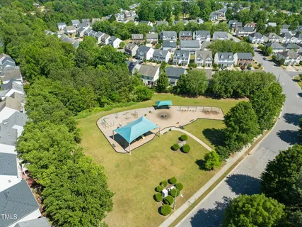 an aerial view of a house with a swimming pool yard and outdoor seating