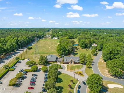 swimming pool view with a garden space