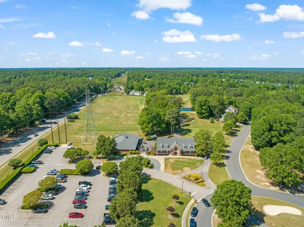 swimming pool view with a garden space