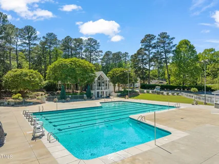 a view of a swimming pool with an outdoor space and seating area