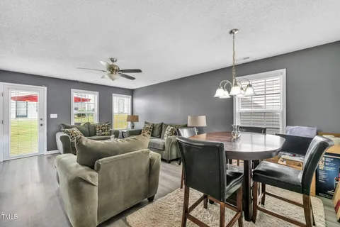a view of a livingroom with furniture and window