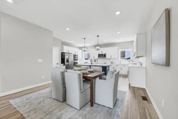 a kitchen with stainless steel appliances kitchen island granite countertop a sink and a stove