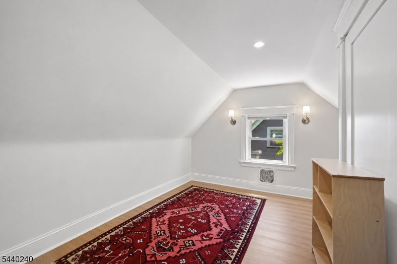 10 Mountain Place Montclair, NJ 07043 - Photo 11 of 21 wooden floor in an empty room with a window