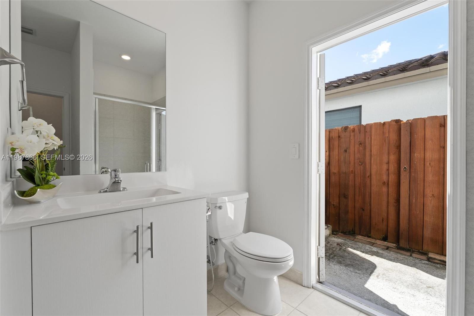 11903 Southwest 241st Street, Unit 11903 Homestead, FL 33032 - Photo 21 of 57 a bathroom with a sink a toilet and shower
