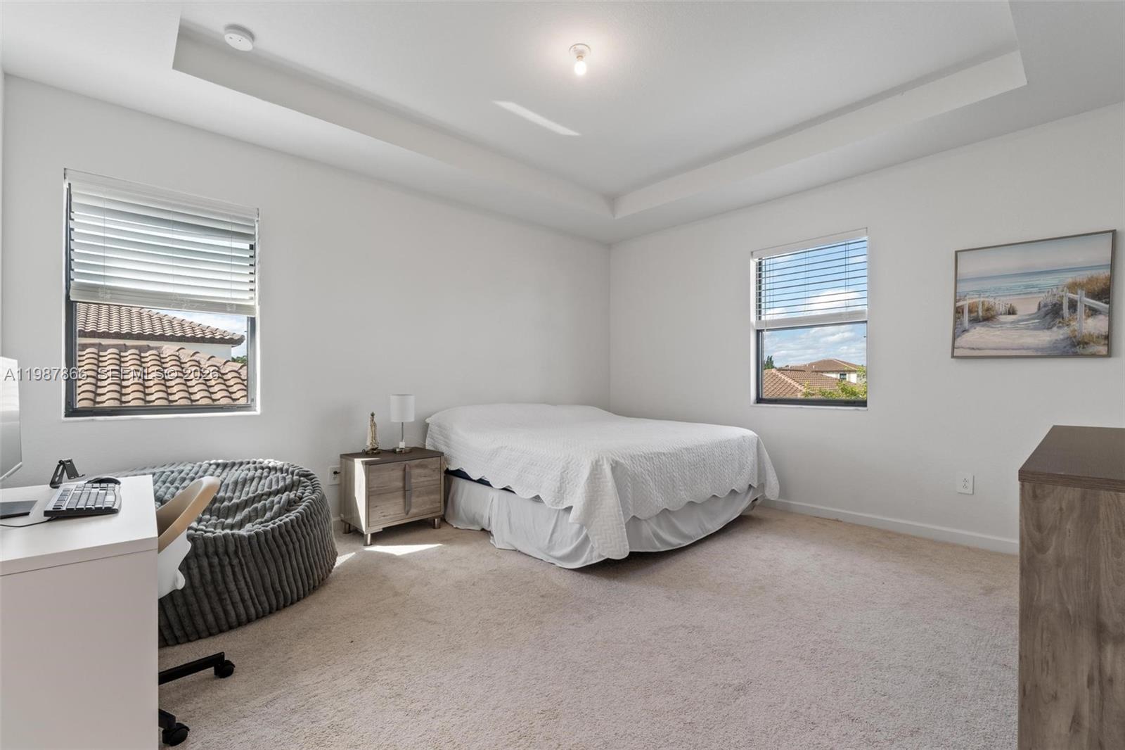11903 Southwest 241st Street, Unit 11903 Homestead, FL 33032 - Photo 29 of 57 a spacious bedroom with a bed and a window