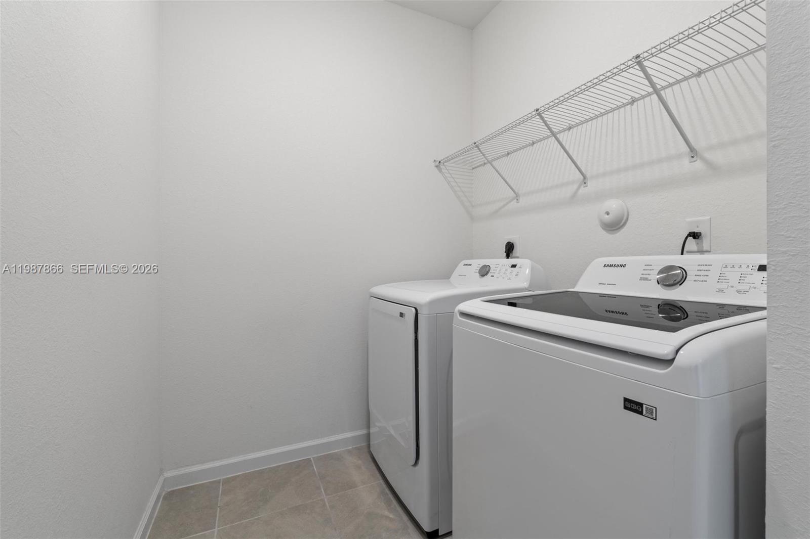 11903 Southwest 241st Street, Unit 11903 Homestead, FL 33032 - Photo 44 of 57 a utility room with dryer and washer