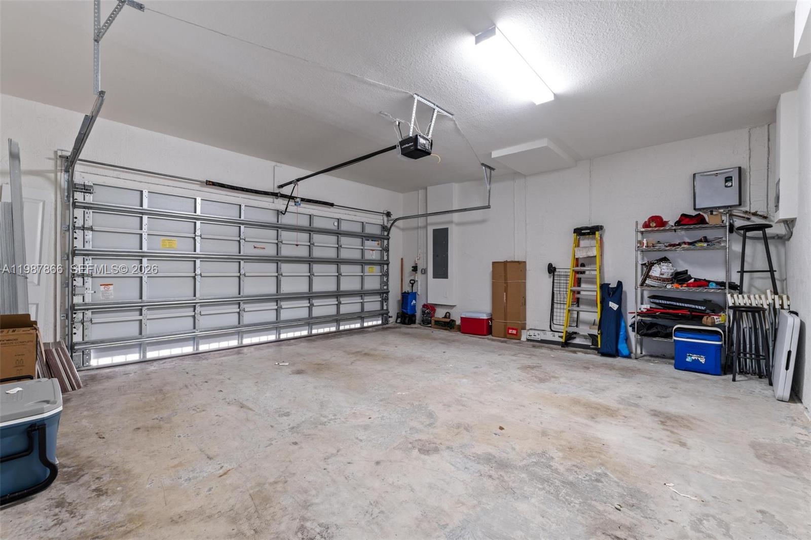 11903 Southwest 241st Street, Unit 11903 Homestead, FL 33032 - Photo 45 of 57 a view of a garage with storage
