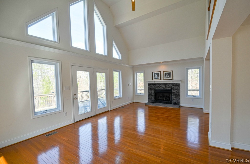 20348 Ben Gayle Road Beaverdam, VA 23015 - Photo 1 of 24 a view of an empty room with wooden floor fireplace and a window