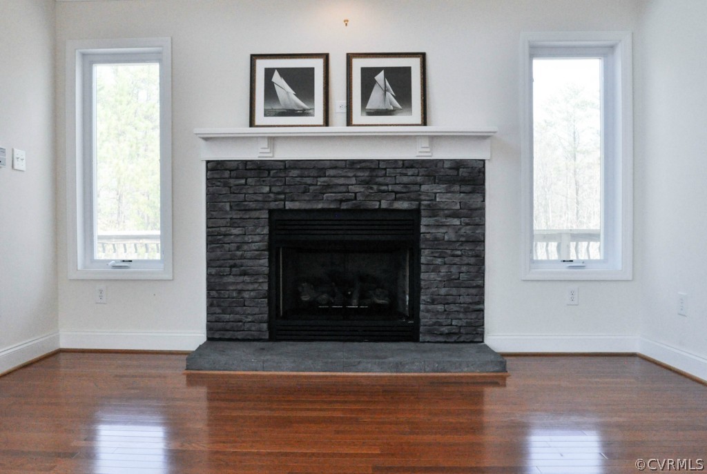 20348 Ben Gayle Road Beaverdam, VA 23015 - Photo 6 of 24 a living room with a fireplace and wooden floor