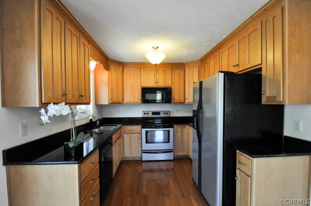 20348 Ben Gayle Road Beaverdam, VA 23015 - Photo 8 of 24 a kitchen with stainless steel appliances a sink stove and refrigerator