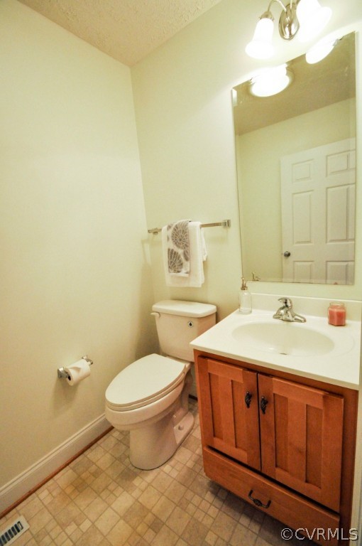 20348 Ben Gayle Road Beaverdam, VA 23015 - Photo 10 of 24 a bathroom with a sink a toilet and mirror