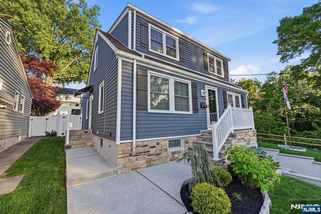 44 Alpine Place Kearny, NJ 07032 - Photo 6 of 50 a front view of a house with a garden
