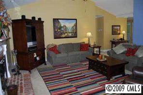 3208 Lentel Road Midland, NC 28107 - Photo 4 of 8 a living room with furniture and a rug
