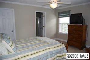 3208 Lentel Road Midland, NC 28107 - Photo 7 of 8 a bedroom with a bed and a television
