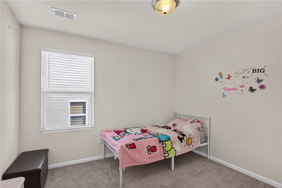 1081 Edenbrooke Circle Anderson, SC 29621 - Photo 32 of 46 A window with blinds illuminates this comfortably carpeted bedroom.