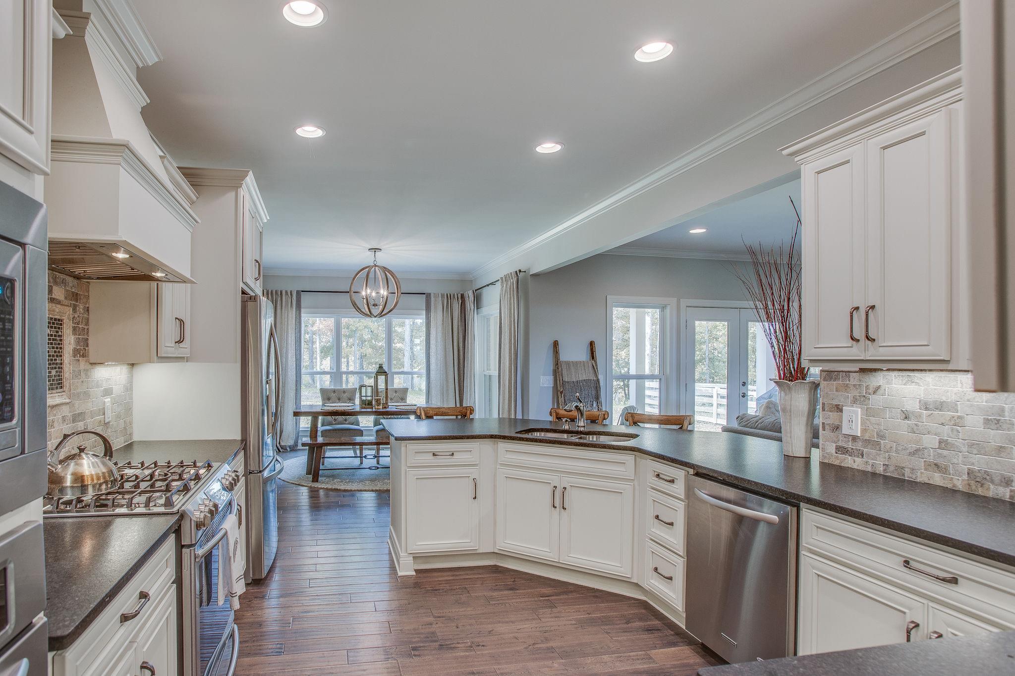 7901 Pinewood Road Fairview, TN 37062 - Photo 12 of 29 a large kitchen with cabinets in it and stainless steel appliances