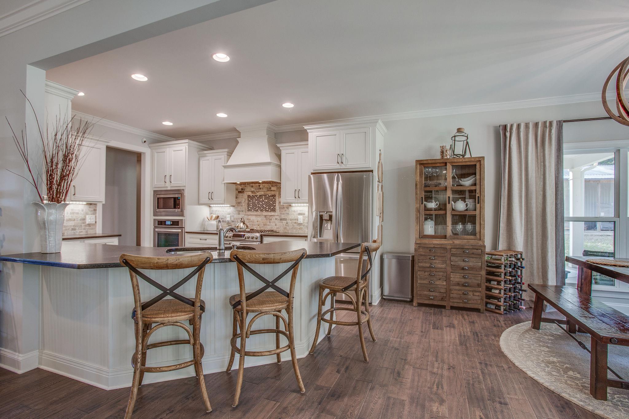 7901 Pinewood Road Fairview, TN 37062 - Photo 14 of 29 a view of a dining room with furniture and wooden floor