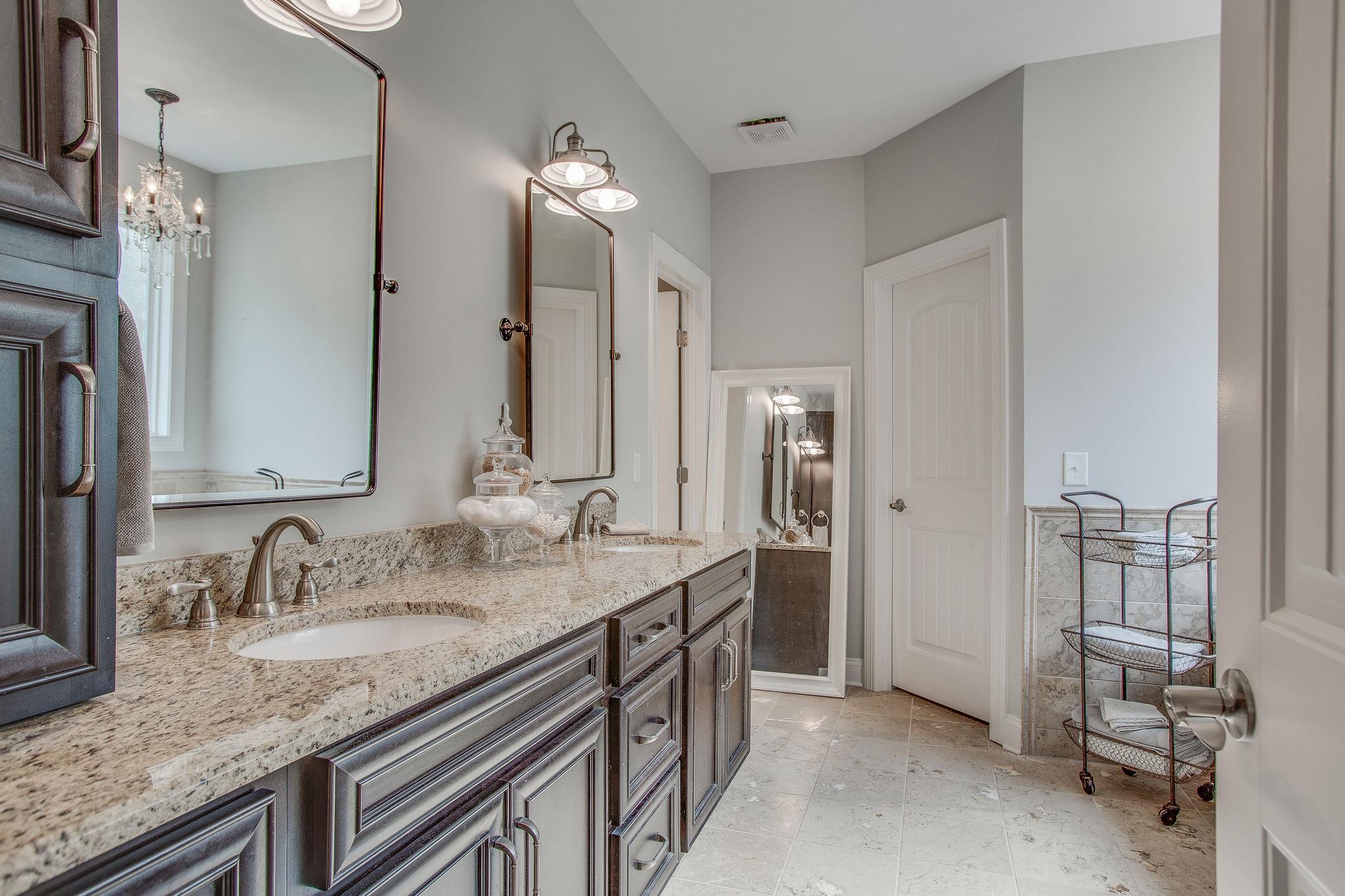 7901 Pinewood Road Fairview, TN 37062 - Photo 16 of 29 a bathroom with a granite countertop double vanity sink and a mirror