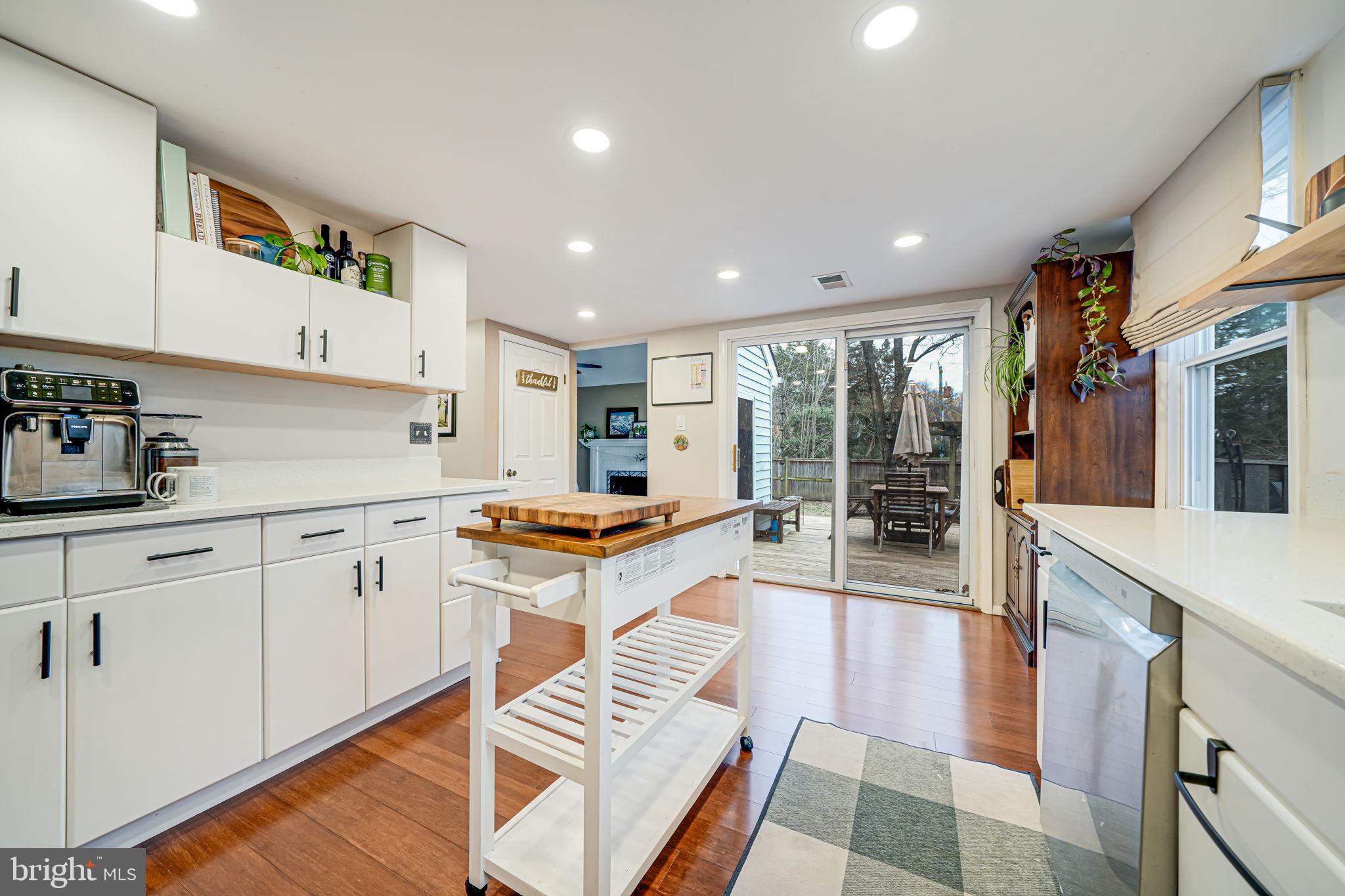 116 Elm Tree Lane Sterling, VA 20164 - Photo 18 of 56 a kitchen with stainless steel appliances granite countertop a stove a sink and a refrigerator